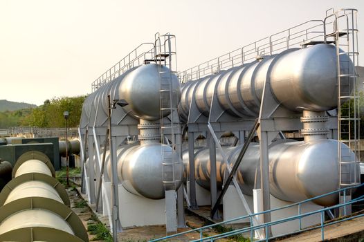 oil tanks and pipes outdoor at day 