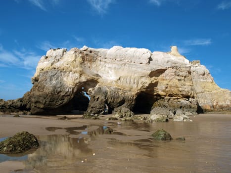 Caves and colourful rock formations on the Algarve coast in Portugal