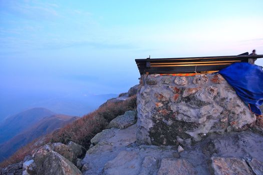 Mountain Over the Sunset and stone building