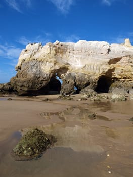 Caves and colourful rock formations on the Algarve coast in Portugal