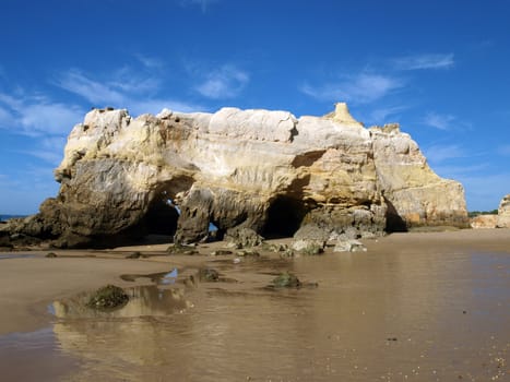 Caves and colourful rock formations on the Algarve coast in Portugal