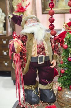 santa claus statue decoration posing with new year souvenir