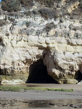 Caves and colourful rock formations on the Algarve coast in Portugal