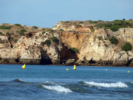 Caves and colourful rock formations on the Algarve coast in Portugal