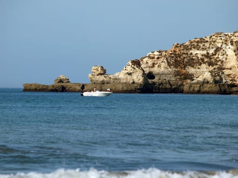 Caves and colourful rock formations on the Algarve coast in Portugal