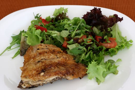 chicken with salad on a plate