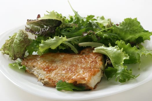 Fried fish with salad