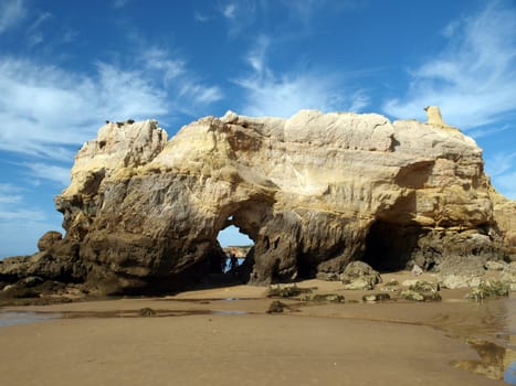 Caves and colourful rock formations on the Algarve coast in Portugal