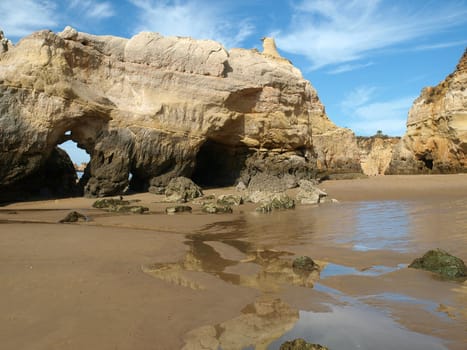Caves and colourful rock formations on the Algarve coast in Portugal