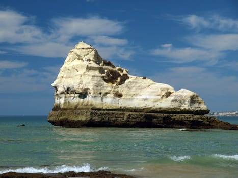 A lonely rock in the ocean. The effect of erosion