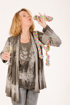 elderly lady celebrates with champagne and streamers