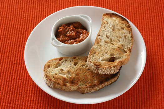 toasts with dip in bowl