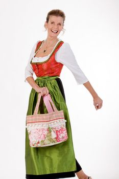 Elan full Bavarian costume elderly lady in dress and fashionable shopping bag