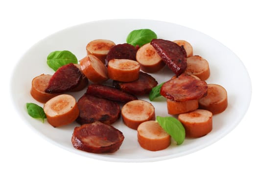 Cut fried sausages on a plate