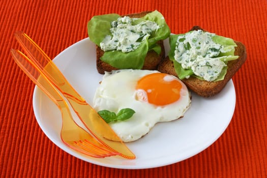 Fried egg with toasts with cream-cheese