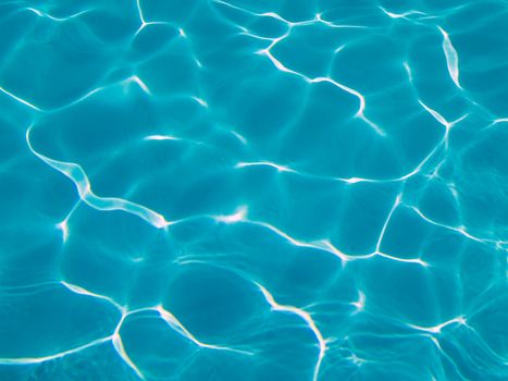 Blue Swimming Pool Water in Full Sunlight