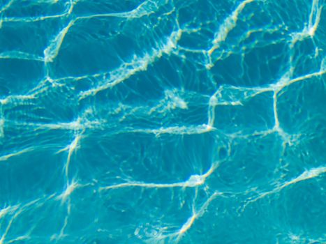 Blue Swimming Pool Water in Full Sunlight