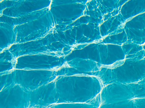 Blue Swimming Pool Water in Full Sunlight