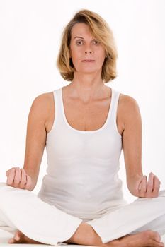 Older lady finds relaxation in yoga