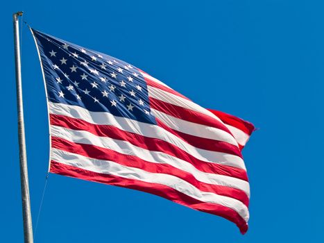 American Flag Waving Proudly on a Clear Windy Day