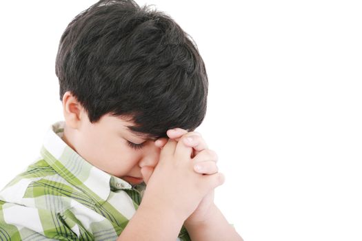 A boys prays earnestly to his creator in heaven