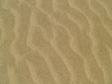 Abstract background of sand ripples at the beach