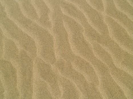 Abstract background of sand ripples at the beach