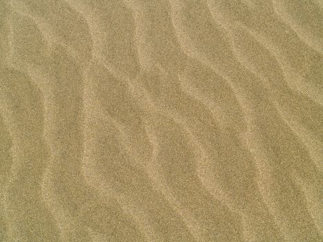 Abstract background of sand ripples at the beach