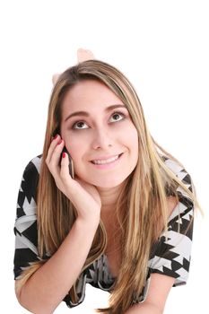 Jolly woman talking on phone lying on a bed at home