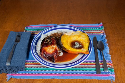 A delicious healthy dinner of Indonesian Chicken, rice and acorn squash