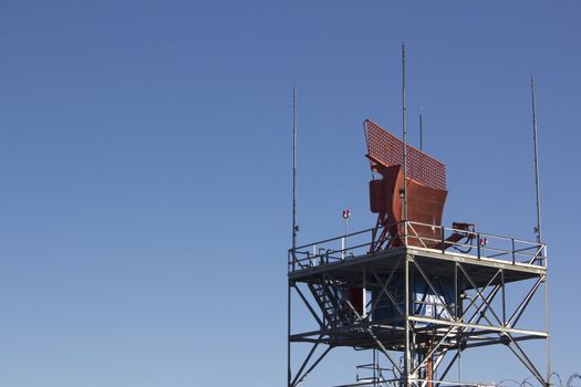 air-traffic control antenna with blue sky background