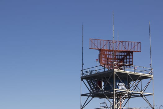 air-traffic control antenna with blue sky background