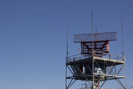 air-traffic control antenna with blue sky background