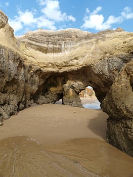 Caves and colourful rock formations on the Algarve coast in Portugal