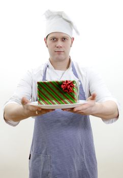 chief cook with a gift on a plate