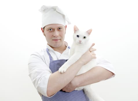 Portrait of handsome chief cook with white cat in hands