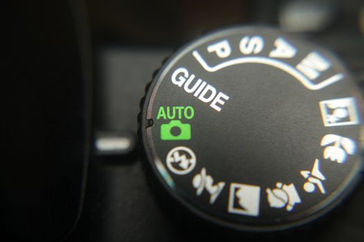 Macro image of a digital camera's controls set on auto