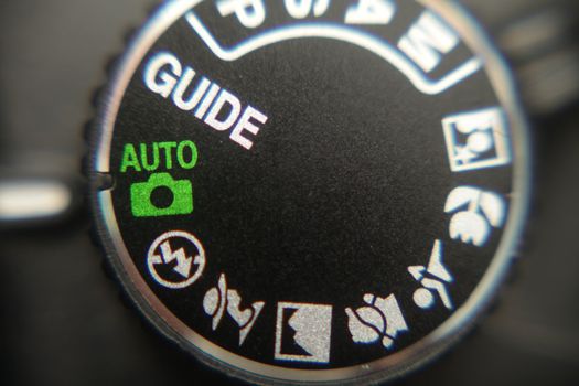 Macro image of a digital camera's controls set on auto