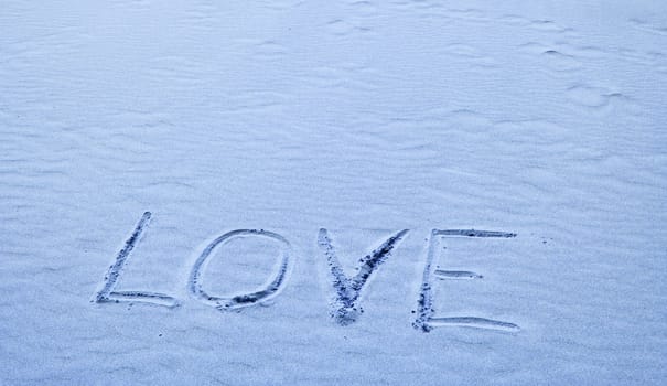 Love Written in Blue Sand on a Sunny Day