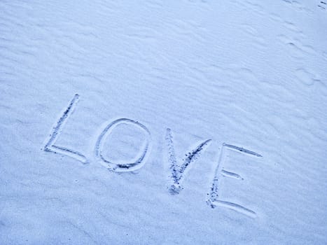 Love Written in Blue Sand on a Sunny Day