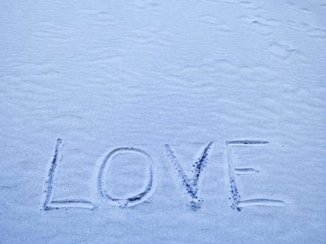 Love Written in Blue Sand on a Sunny Day