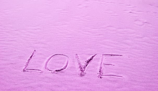 Love Written in Pink Sand on a Sunny Day