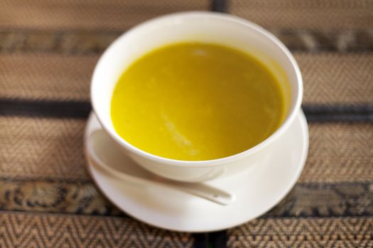 Bowl of pumpkin soup in a restaurant