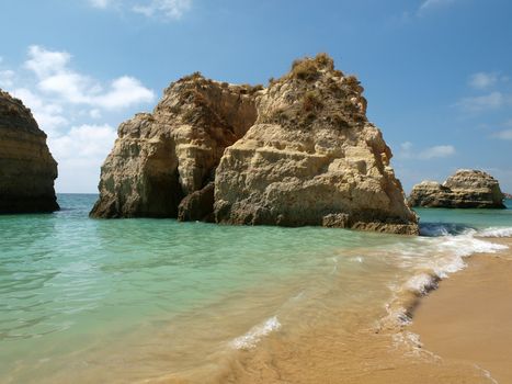 Caves and colourful rock formations on the Algarve coast in Portugal