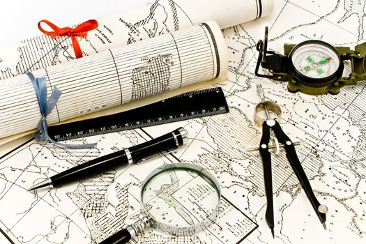 Old Maps in rolls with tools for navigation