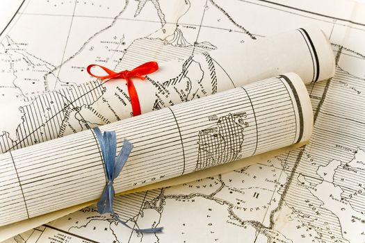 Olda Maps in rolls with colorful ribbons