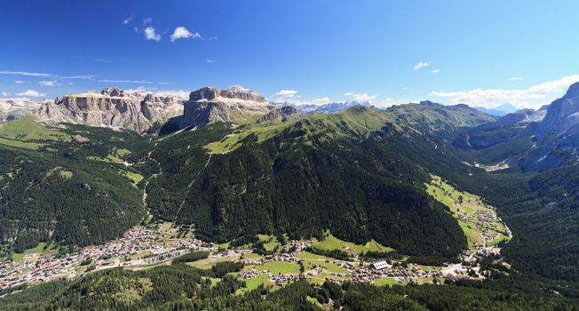 Panoramic view of Canazei and Fassa valley with Saas Pordoi mount, Fedaia and Pordoi pass 