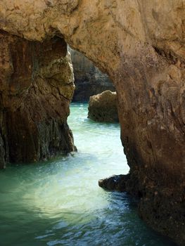 Caves and colourful rock formations on the Algarve coast in Portugal