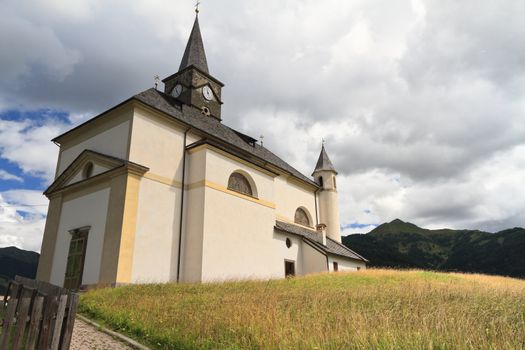 characteristic alpine church in Laste, Veneto Italy