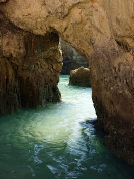 Caves and colourful rock formations on the Algarve coast in Portugal